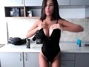 Brunette in sexy outfit taking a hot coffee